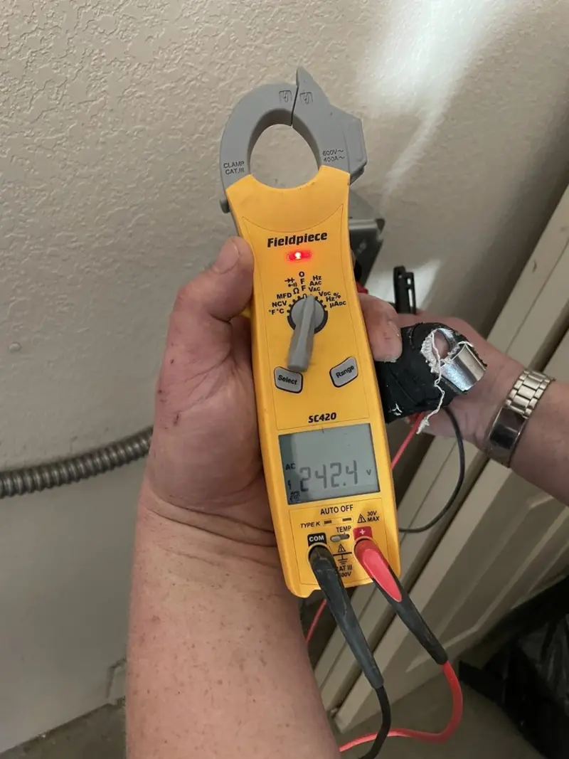 Voltage testing with clamp meter during Hot Tub / Pool Electrical Wiring in Hinesburg